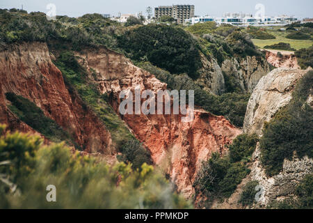 Sandstone limestone rocks of reddish color in Portugal Stock Photo