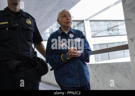 Washington, District of Columbia, USA. 25th Sep, 2018. United States Capitol Police detain a demonstrator in the Hart Senate Office Building on Capitol Hill. The demonstrators are protesting against the nomination of Judge Brett Kavanaugh to be a Supreme Court Associate Justice. Credit: Alex Edelman/CNP/ZUMA Wire/Alamy Live News Stock Photo