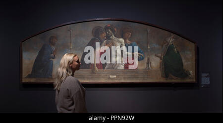 National Gallery, London, UK. 27 September, 2018. Following their respective careers in Padua and Venice, and Mantegna’s fame as court painter to the powerful Gonzaga family in nearby Mantua, ‘Mantegna and Bellini’ is the first-ever exhibition to explore the creative links between these artists and brothers-in-law. Image: Giovanni Bellini, The Lamentation over the Dead Christ, with Saints Mark and Nicholas of Bari, about 1457-9. Ducal Palace, Venice. Credit: Malcolm Park/Alamy Live News. Stock Photo