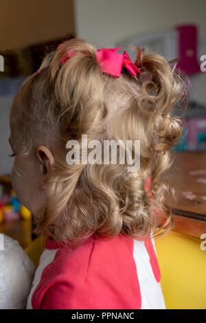 Beautiful curly hair of 22 month old Lily Stock Photo