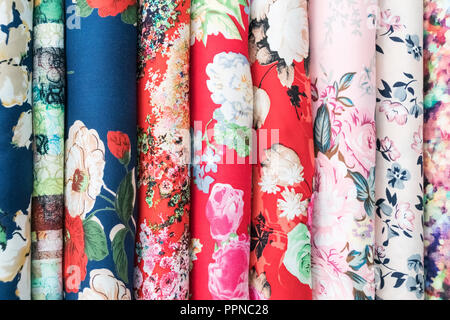 Samples of fabric - printed cotton of different colors on the display case Stock Photo