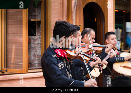 TORONTO, ON, CANADA - JULY 29, 2018: A mariachi band plays in front of a crowd in Toronto's vibrant Kensington Market. Stock Photo