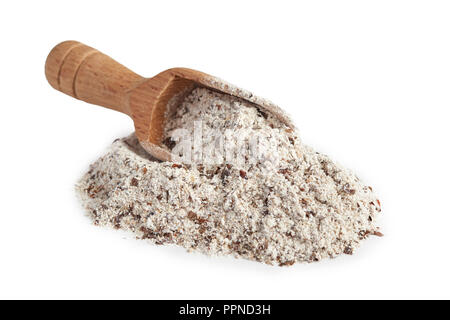 Pile of buckwheat flour with wooden scoop isolated on white background Stock Photo
