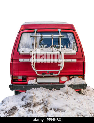 Isolated Retro Vintage Red Camper Van Parked In The Snow On A White Background Stock Photo