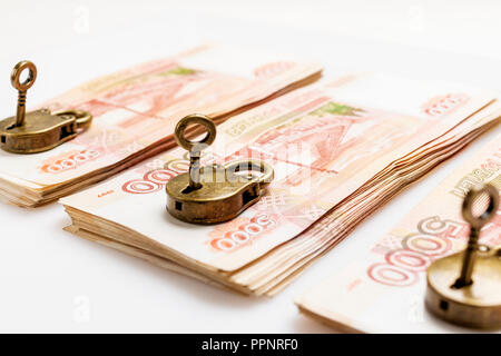 Money is protected. Cash in the Bank under lock and key. Padlock symbol of the safety of savings. Isolated. Stock Photo