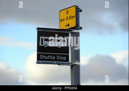 SHUTTLE STOP BUS SIGN WITH PARKING SIGN UK Stock Photo
