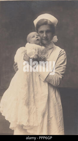 Vintage Blackpool Photograph of a Nursemaid Holding a Baby Boy. Stock Photo