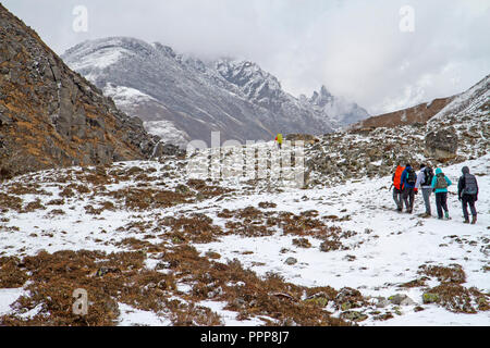 Trekkers heading towards Gokyo village Stock Photo