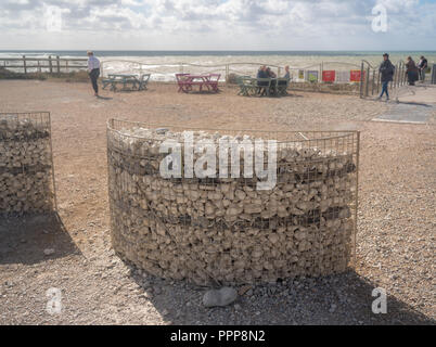 Parking space for disabled driver built from beach pebbles
