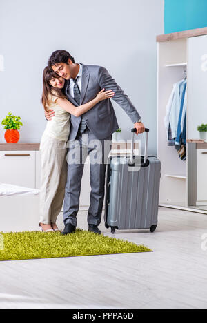 Wife seeing her husband off to business trip Stock Photo - Alamy