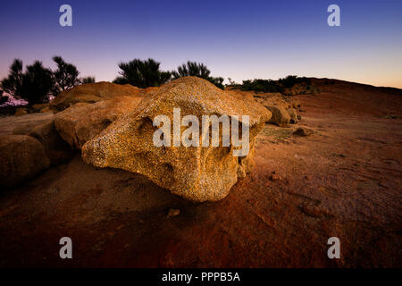 Erosion leaving large granite rock on top of Elachbutting Rock Western Australia Stock Photo