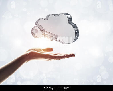 Cloud computing concept with glass symbol shown in hand Stock Photo