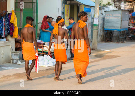 RAMESWARAM, RAMESHWARAM, PAMBAN ISLAND, TAMIL NADU, INDIA - March circa, 2018. A Group of unidentified Sadhus pilgrims dressed in orange clothes. Stock Photo