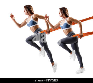 Young sporty woman using a resistance band. Stock Photo