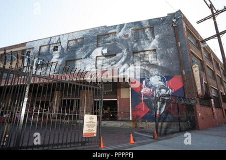 'Wrinkles in the City,' a mural by JR of France, on Angel City Brewery at Traction Avenue and Rose Street in the Arts District in Los Angeles, CA Stock Photo
