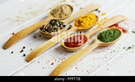 Composition of wooden spoons with spices Stock Photo