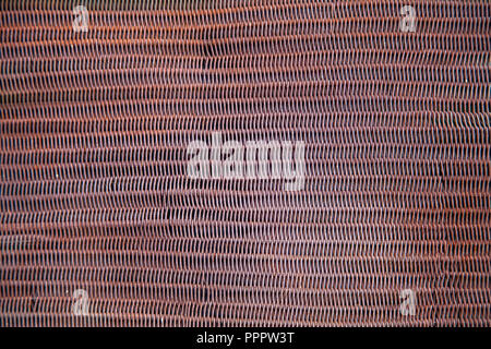 The texture of a shallow old rusty metal mesh Stock Photo