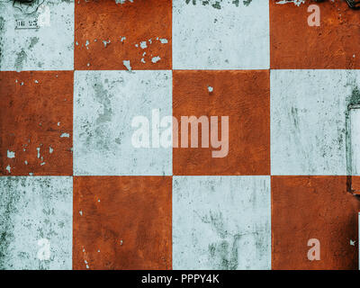 grungy looking Red and white checkered wall Stock Photo