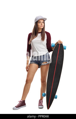 Full length portrait of young female with skateboard isolated on white background Stock Photo