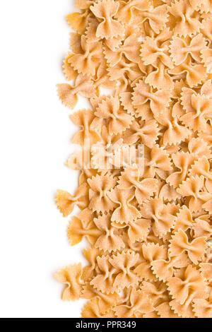 Wholewheat farfalle pasta. Tasty italian pasta isolated on white background. Stock Photo