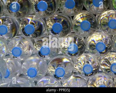 Close Up on mineral water bottles in top view. Stock Photo