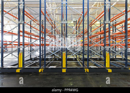 Mobile aisle racking system in distribution warehouse Stock Photo