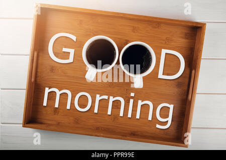 good morning - two coffee cups on a tray with text Stock Photo