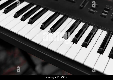 Synthesizer piano key board top view.Professional electronic midi keyboard with black and white keys. Stock Photo