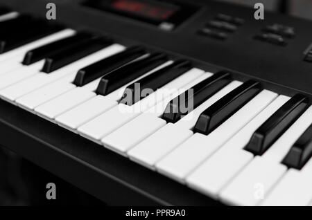 Synthesizer piano key board top view.Professional electronic midi keyboard with black and white keys. Stock Photo