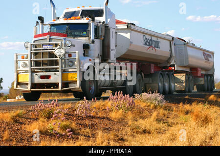 Road train travelling on an outback road in the Kimberleys, Western Australia Stock Photo