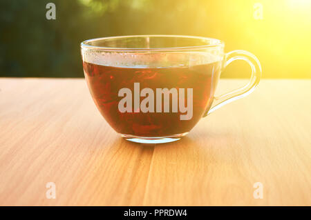 A cup of tea glass in the sunlight Stock Photo