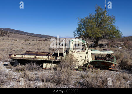 World War II era 1 1/2 ton Chevrolet truck, likely originally built for the US Army, now sits abandoned at a mine site in Hamilton, Nevada. Stock Photo