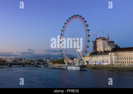 Sunset panorama of the River Thames, County Hall, river bank and London Eye, London, UK