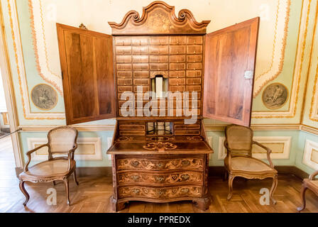 Queluz, Portugal - December 9, 2017: Sideboard Inside of rich decorated Queluz Royal Palace. Formerly used as the Summer residence by the Portuguese r Stock Photo