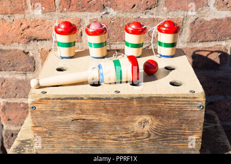 Vintage chidren's wooden toy - ball and cup in a box. UK Stock Photo