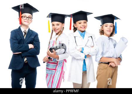 schoolchildren in costumes of different professions and graduation caps isolated on white Stock Photo