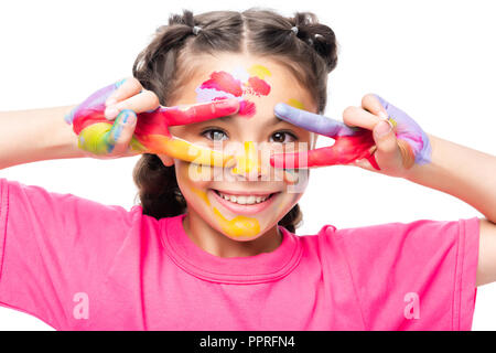 schoolchild having fun with painted hands isolated on white Stock Photo