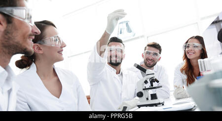 group of young workers are working in biochemistry lab, Stock Photo