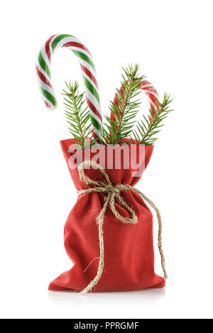 Bag of red color with Christmas gifts, isolated on white background Stock Photo