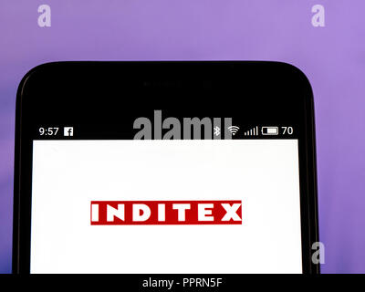 Inditex logo seen displayed on smart phone. Industria de Diseno Textil, S.A. is a Spanish multinational clothing company is the biggest fashion group in the world, operates over 7,200 stores in 93 markets worldwide. Stock Photo