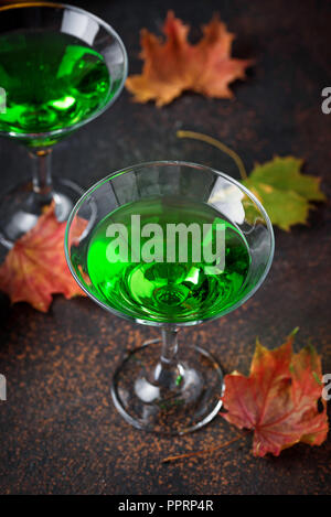 Halloweens spooky drink green martini cocktail Stock Photo