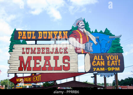 Large billboard with a picture of Paul Bunyan and Babe the Blue Ox advertising the All You Can Eat Lumberjack Meals. Wisconsin Dells Wisconsin WI USA Stock Photo