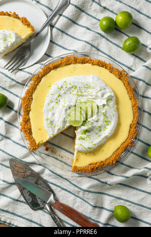 Sweet Homemade Key Lime Pie with Zest and Cream Stock Photo