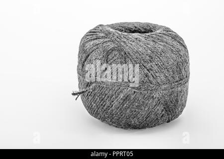 Natural tarred sisal garden twine / string. Grungy B&W conversion of PPRT01 ball of string. Stock Photo