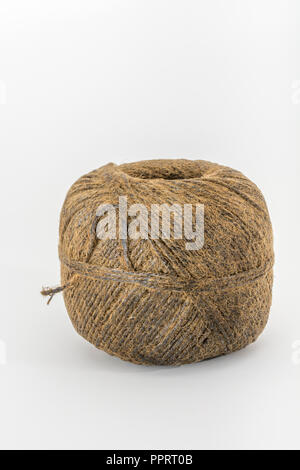 Natural tarred sisal garden twine / string. Metaphor 'How long is a piece of string?' Stock Photo