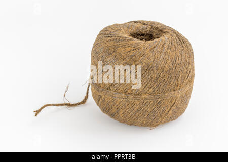 Natural tarred sisal garden twine / string. Metaphor 'How long is a piece of string?' Stock Photo