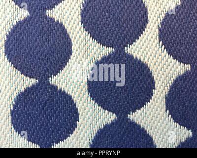 Blue dots on white background, macro view showing fabric textures. Stock Photo