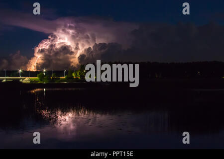 Thunderstorm cloud early in the morning, in summer in August, before sunrise, power of nature background