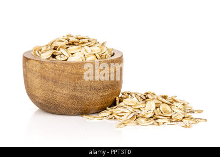 Set of lot of whole flat raw rolled oats with wooden bowl isolated on white background Stock Photo