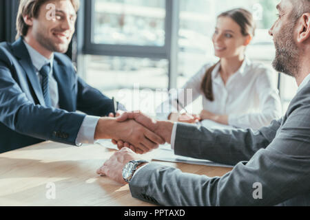business people shaking hands during meeting at modern office Stock Photo